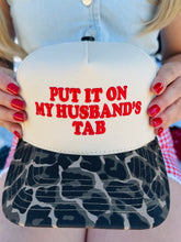 Put It On My Husband’s Tab Trucker Hat