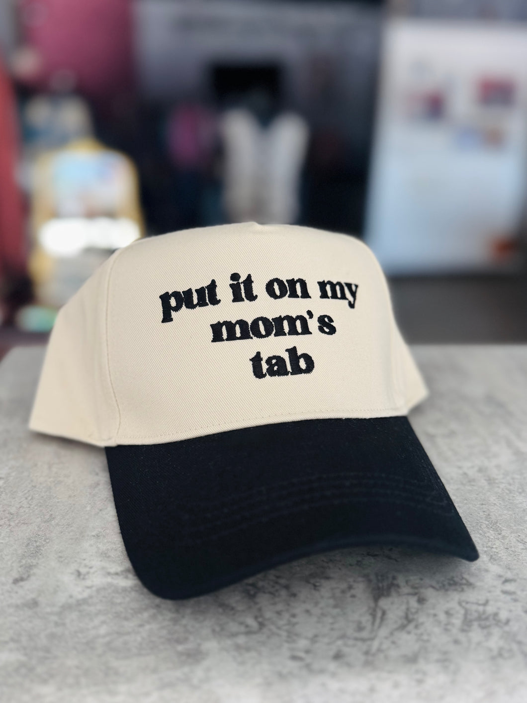 Put It On My Mom’s Tab Trucker Hat